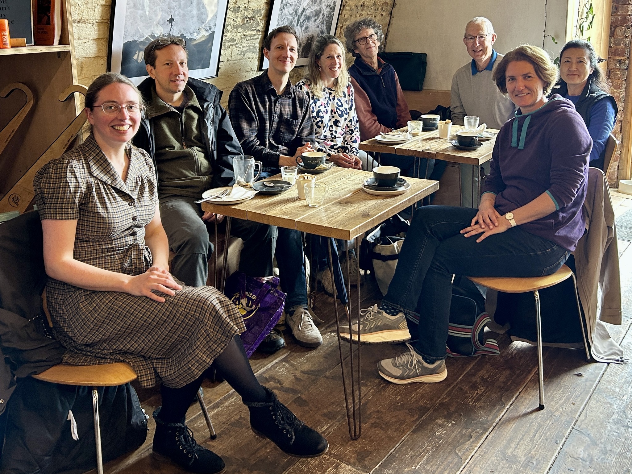 Members of the Exeter Piano Meetup Group standing around a grand piano in the Cygnet Theatre.